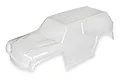 A clear, unpainted polycarbonate body shell for the LaTrax Teton RC truck, shown from a high-angle side view against a white background.