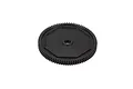 A black plastic spur gear for an RC car, featuring a central hole and a distinct octagonal molded pattern on its face.