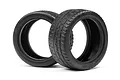 Two black HPI Racing wide radial RC touring car tires standing upright on a white background.