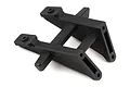 A black plastic Traxxas wing mount spare part shown from a high angle against a white background.