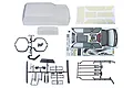 Unpainted Element RC Trailrunner body shell kit including clear polycarbonate body, window masks, decal sheets, and various black plastic accessory parts.
