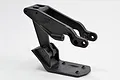 A black RPM HD wing mount with integrated rear skid plate for RC vehicles, shown from a side angle against a white background.
