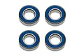 Four Factory Team rubber shielded ball bearings arranged in a square grid against a white background.