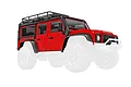 A red Traxxas 1/18 scale Land Rover Defender body shell with black roof rack, snorkel, and fender flares, shown against a white background.