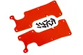 Two red plastic RC rear suspension arm covers with a set of small black mounting screws on a white background.
