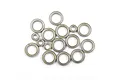 A collection of various sized metal ball bearings for an RC car, arranged on a white background.