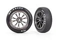Two Traxxas 2.2 inch Mickey Thompson ET Front tyres pre-glued onto Weld satin black chrome rims, shown from side and angled views.