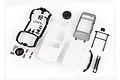 An unpainted white Traxxas 1/18 Ford Bronco body shell kit with various black plastic accessories, clear window inserts, and a decal sheet on a white background.
