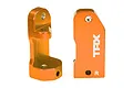 Two orange anodized aluminium C-hub carriers for Traxxas RC vehicles, showing the TRX logo and R marking.