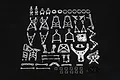 A comprehensive set of silver aluminium RC suspension and chassis upgrade parts for a Rovan Baja model, laid out on a black background.