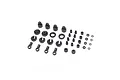 A collection of black plastic RC shock absorber spare parts arranged on a white background.