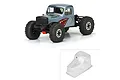 A composite image showing a painted, assembled RC crawler truck and an unpainted, clear Pro-Line Comp Wagon body shell.