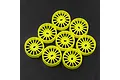 A set of eight fluorescent yellow narrow RC rims for Mini-Z cars arranged on a dark textured surface.