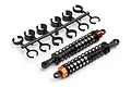 Two HPI Racing RC shock absorbers with black springs and orange collars, alongside a plastic tree of suspension spacers on a white background.