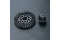 A black metal bevel gear and a smaller pinion gear from MST, displayed on a textured black surface.