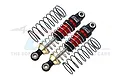Two GPM Racing red and black adjustable aluminium RC shock absorbers with two separate black coil springs on a white background.