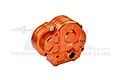 An orange anodized aluminium gearbox case for RC cars by GPM Racing, featuring a 7075 alloy marking.