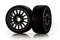 Two Jetko 1/8 scale Vertex ultra soft belted tyres mounted on black Radia rims, shown against a white background with reflections.