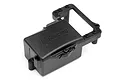 A black plastic HPI Racing radio box for RC cars, featuring an embossed logo and a metal body clip, isolated on a white background.