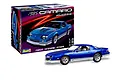 A Revell 1/24 scale 1985 Chevy Camaro Z28 plastic model kit box next to a fully assembled and painted blue model car.