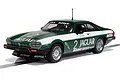 A 1/32 scale Scalextric Jaguar XJS slot car in green and white livery with number 2, displayed on a section of slot car track.