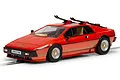 A 1/32 scale Scalextric James Bond Lotus Esprit Turbo slot car in metallic red with skis mounted on the roof, displayed on a track section.