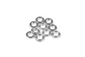 A cluster of ten small, silver-coloured aluminium shims or washers arranged on a white background.