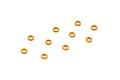 Ten small orange anodized aluminium shims arranged on a white background.