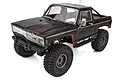 A black Element RC Enduro Trailwalker 1/10 scale RC rock crawler truck with red weathered detailing on a white background.