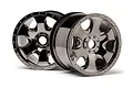 Two HPI Savage Warlock RC monster truck rims in a black chrome finish, shown from a front-facing angle against a white background.