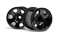 Two black HPI Warlock RC stadium truck rims with a six-spoke design and beadlock-style detailing on a white background.