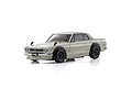 A white Kyosho Mini-Z Nissan Skyline 2000GT-R Tune Version body shell, featuring black fender flares and black wheels, shown against a white background.