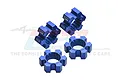 Four blue anodized aluminium RC wheel hex adapters from GPM Racing, featuring a 6-spoke design and laser-etched branding.