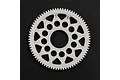 A white Delrin 78T 64dp spur gear for RC cars, featuring a lightweight design with circular and triangular cutouts, set against a black textured background.