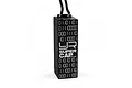 A black Yeah Racing aluminium super capacitor with binary code patterns and the YR logo printed on the side, isolated on a white background.