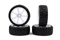Four Rush 1/10 scale RC touring car wheels with white seven-spoke rims and black radial tread rubber tyres.