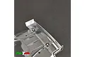 A clear, unpainted MonTech 1/10 scale touring car wing mounted on a black surface.