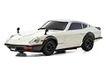 A white Kyosho Mini-Z Nissan Fairlady 240ZG RC car model, featuring black fender flares, black wheels, and a front license plate reading Fairlady Z.