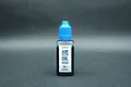 A 30ml bottle of Koswork Competition Engine Air Filter Oil with a blue cap against a dark grey background.
