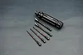 Koswork quick release hex driver handle with five interchangeable hex driver bits of varying sizes on a grey background.