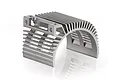 A silver-coloured aluminium motor heat sink with a curved, finned design for RC car motors.