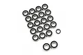A collection of small metal ball bearings with black rubber seals arranged on a white background.