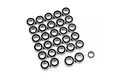 A collection of numerous small metal ball bearings with black rubber seals arranged on a white background.