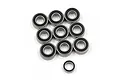 A collection of ten rubber shielded ball bearings of varying sizes arranged on a white background.