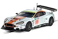 Scalextric 1/32 scale Aston Martin DBR9 Gulf Edition slot car in light blue with orange racing livery, number 009, on a track section.