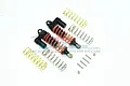 Two black GPM Racing piggyback RC shock absorbers with orange springs, plus extra gold and silver springs and mounting hardware.