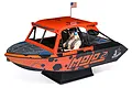 Pro Boat 1/6 24 inch Jetstream RTR jet boat in Mojo Orange livery, featuring a driver figure and American flag on a display stand.