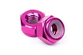Two purple anodized aluminium nyloc nuts for RC cars, shown against a white background.