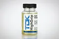 A bottle of TDK High Grip tyre sauce with a black cap and clear liquid inside, set against a white background.