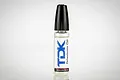 A small clear plastic bottle of TDK Drivetrain Oil with a black cap, standing against a white background.